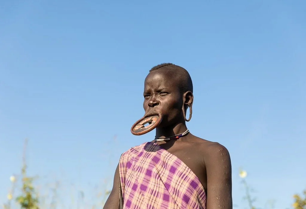 Mursi tribe woman wearing traditional lip plate Ethiopia